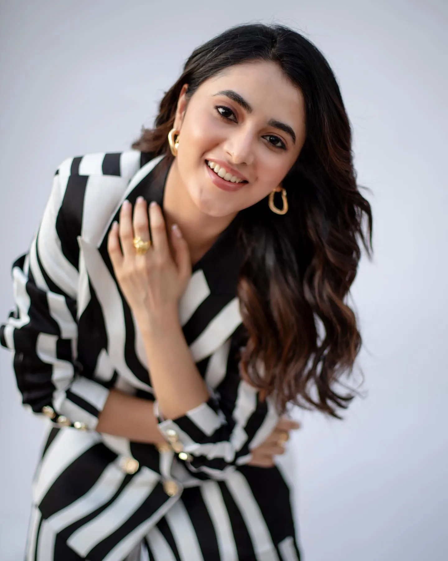 Joyful Priyanka in black and white striped outfit Wallpaper