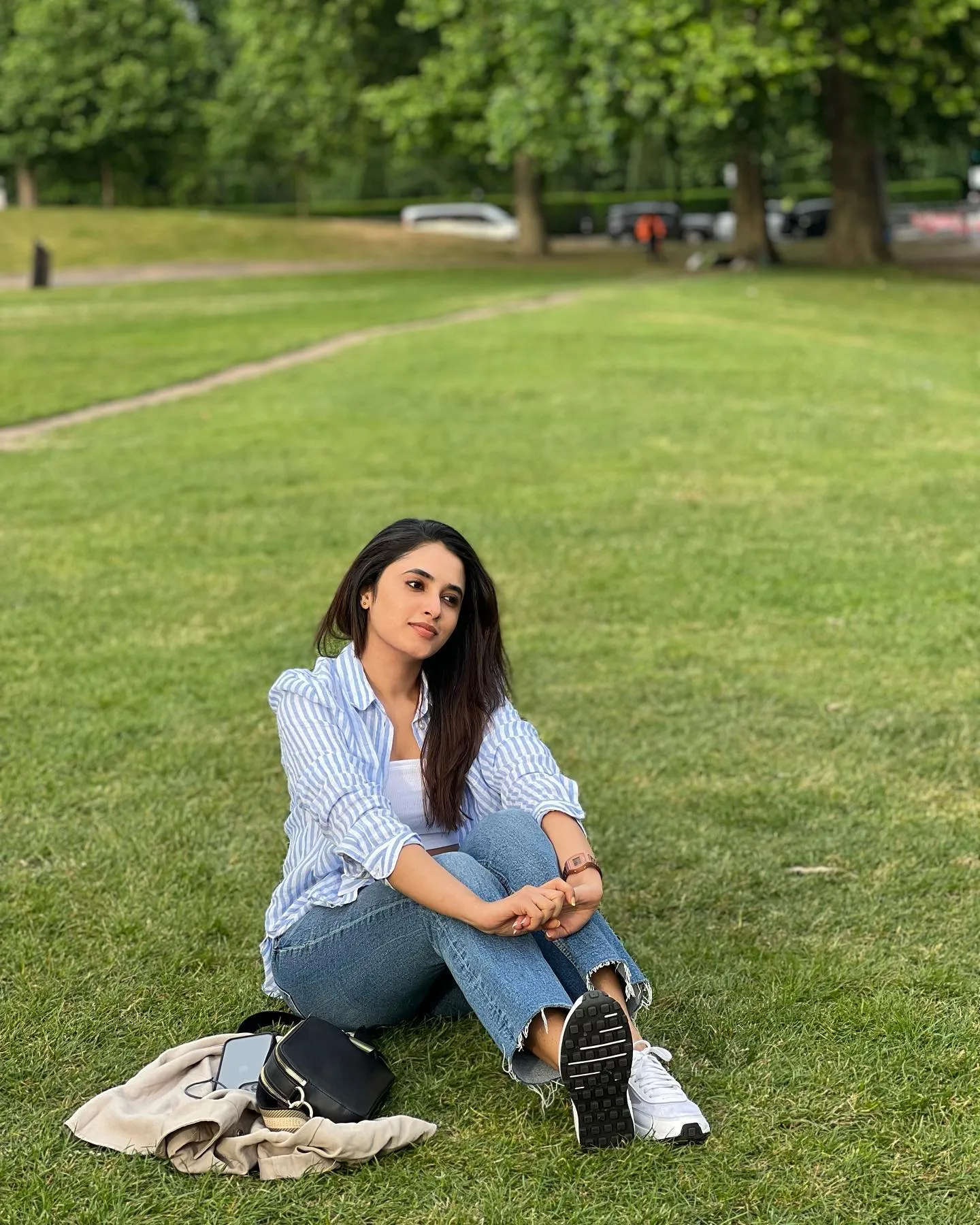 Outdoor Image of Priyanka Mohan Sitting on the Grassy Field