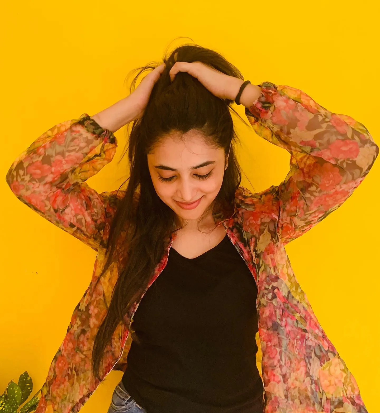 Playful Priyanka Arul Mohan Posing Against Yellow Background