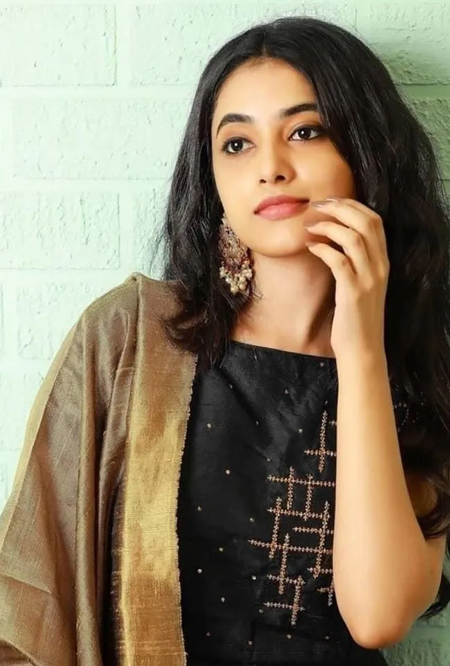 Portrait image of Priyanka in a casual black dress Wallpaper