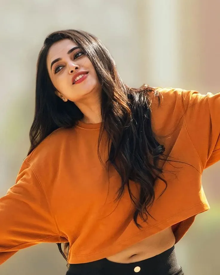 Priyanka Arul Mohan Bold Pose in Bright Orange Outfit HD