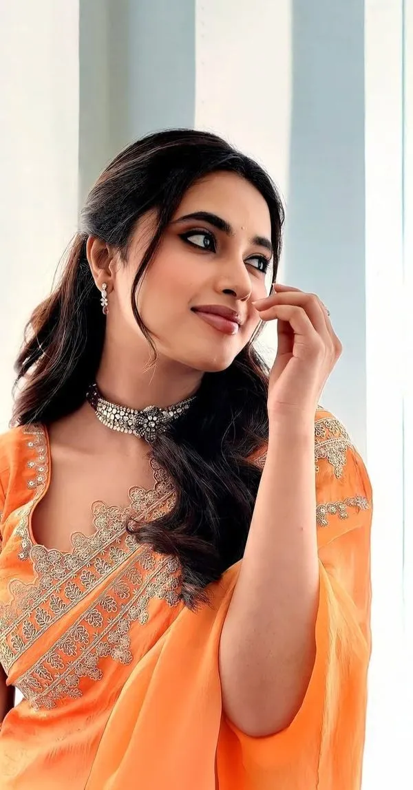 Priyanka Arul Mohan Bright Smile in Orange Saree Wallpaper