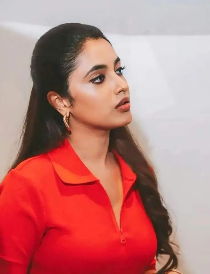 Priyanka Arul Mohan confident look in bright red dress