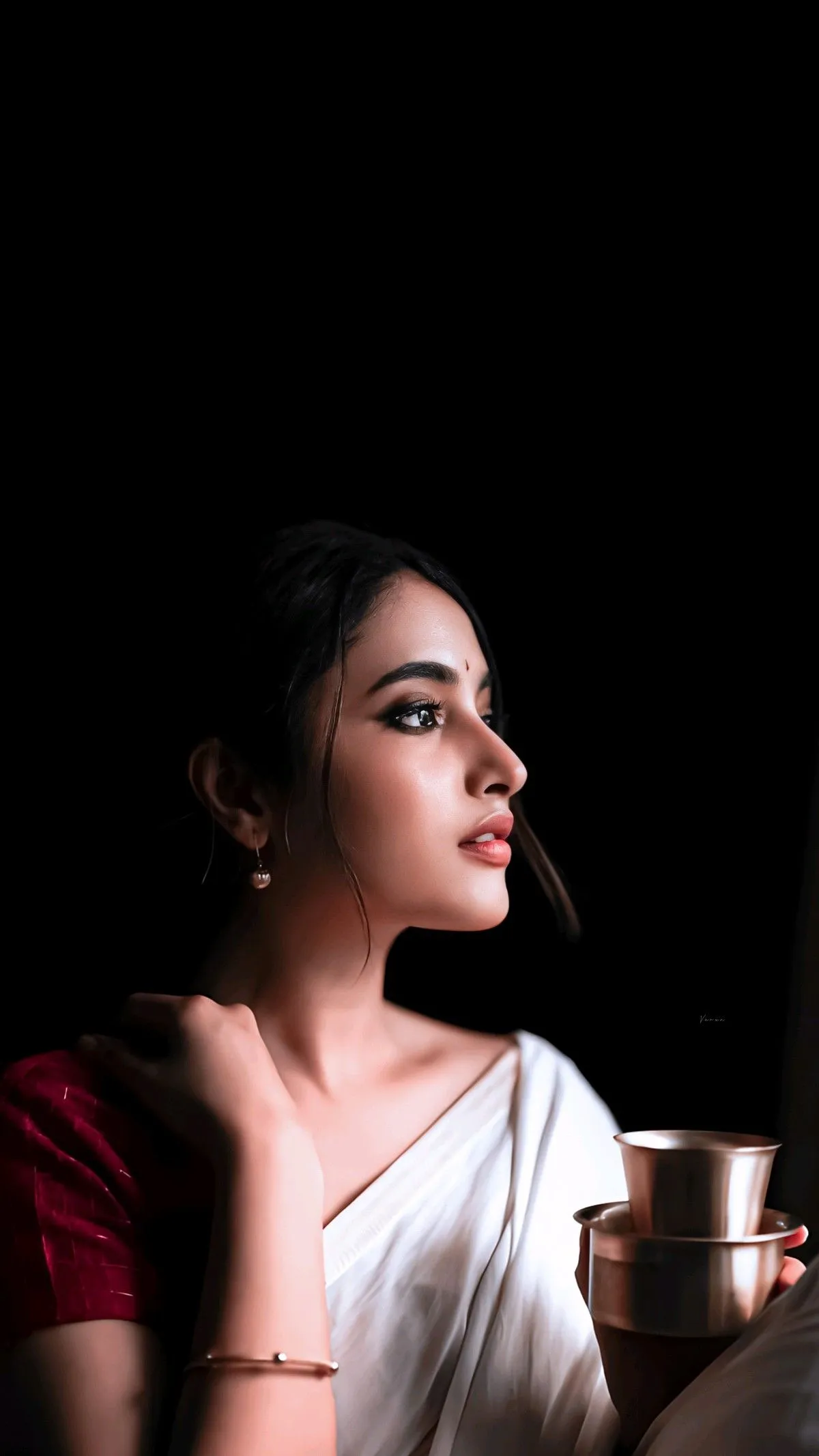 Priyanka Arul Mohan Elegant Side Pose with Mug Wallpaper