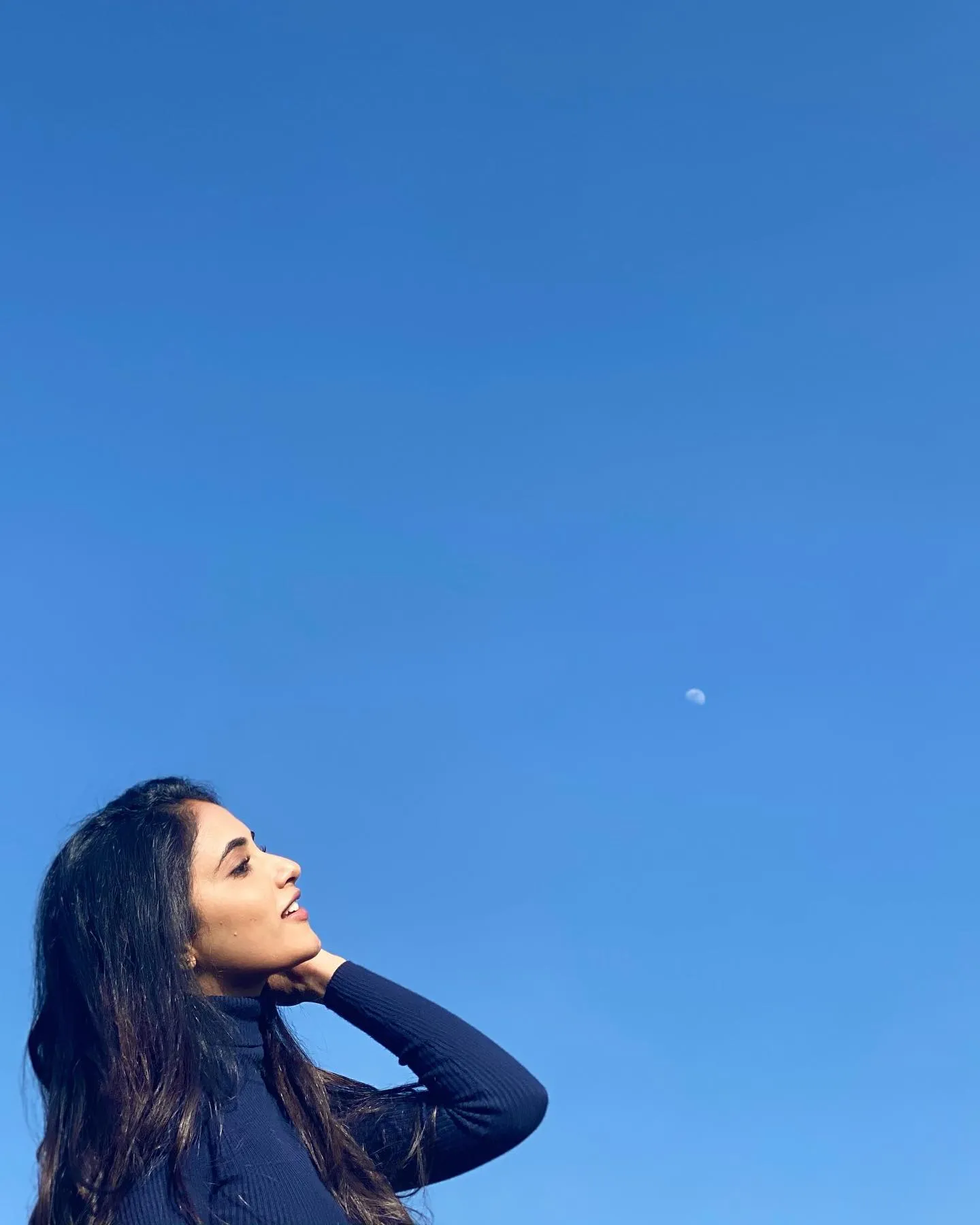 Priyanka Arul Mohan gazing up at sky in casual outside mood