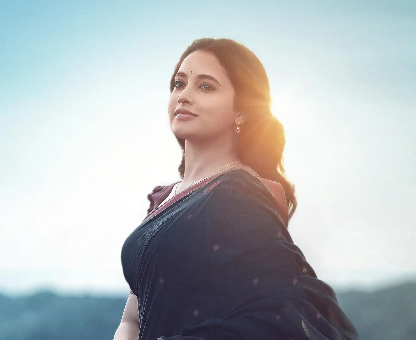 Priyanka Arul Mohan in Black Dress with Scenic Backdrop
