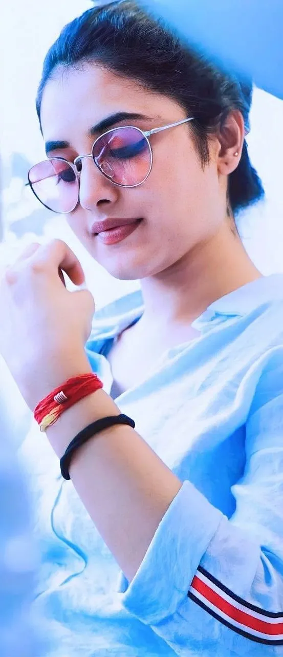 Priyanka Arul Mohan in casual glasses and light blue shirt