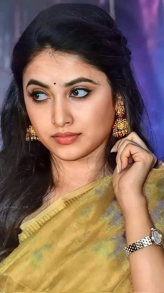 Priyanka Arul Mohan in Classic Yellow Saree with Earrings