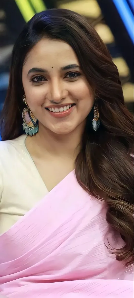 Priyanka Arul Mohan in pink saree with radiant warm smile