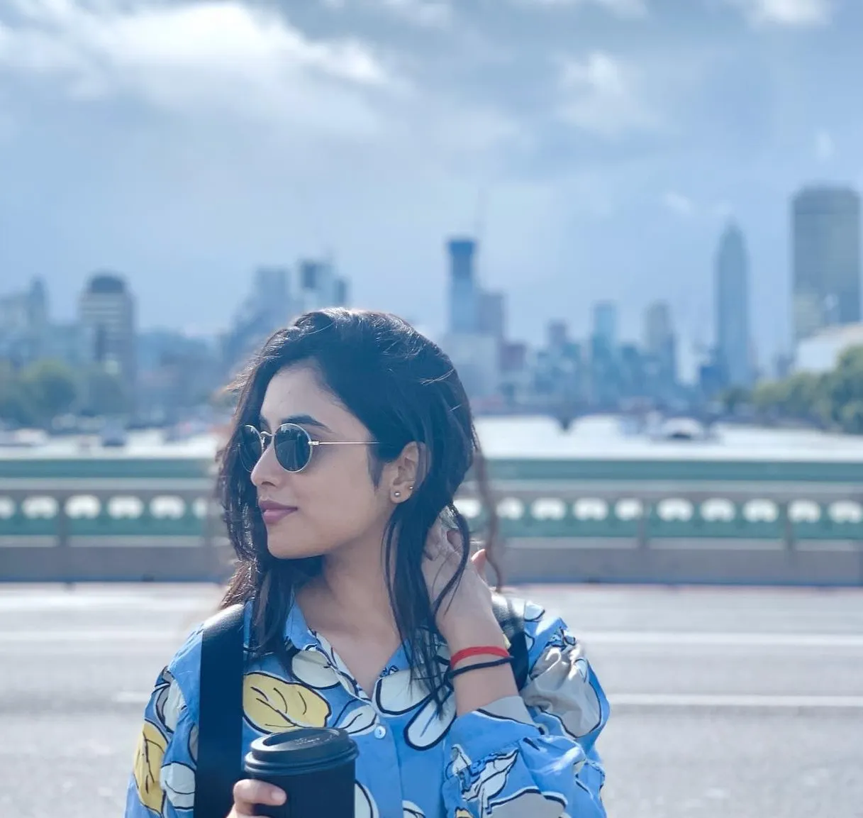 Priyanka Arul Mohan in shirt with a City Background HD