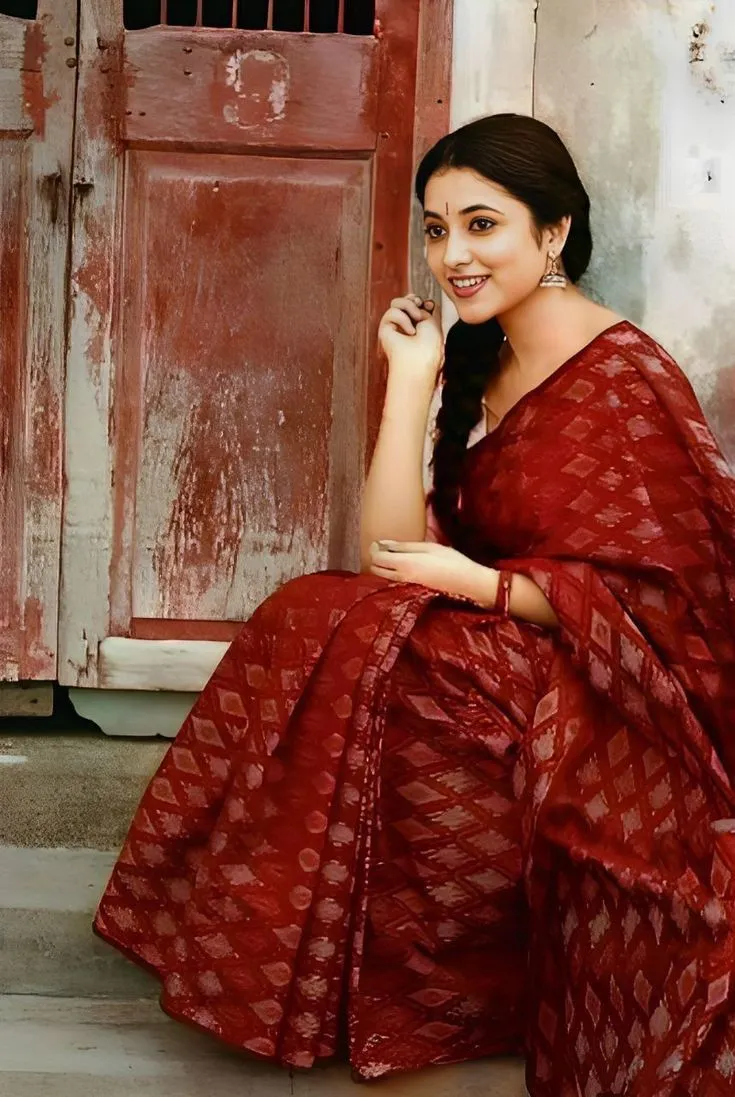 Priyanka Arul Mohan in Traditional Red Saree Sitting Pose