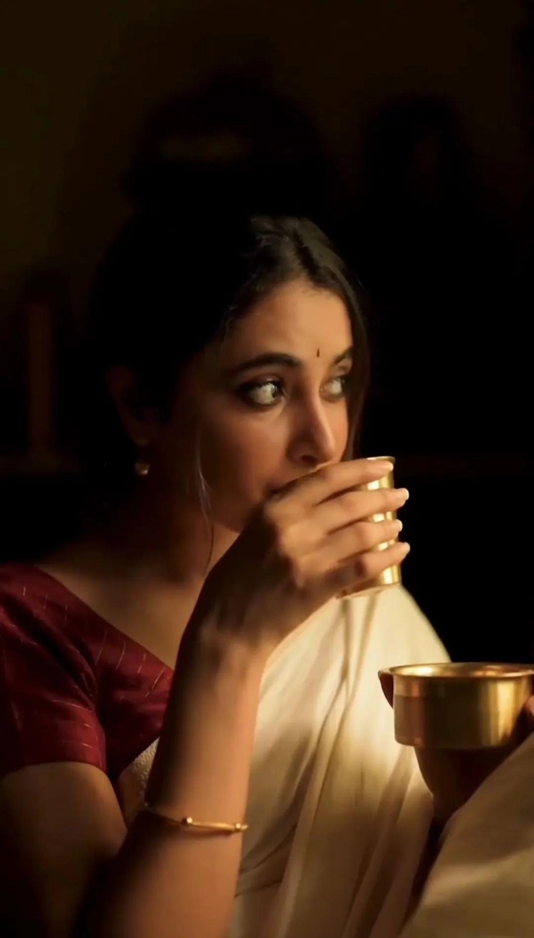 Priyanka Arul Mohan in Warm Candlelight drinking Coffee