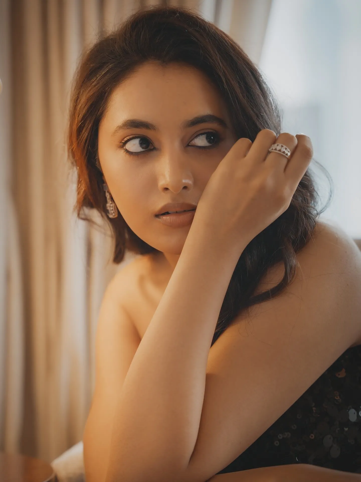 Priyanka Arul Mohan looking calmly at the sideways image