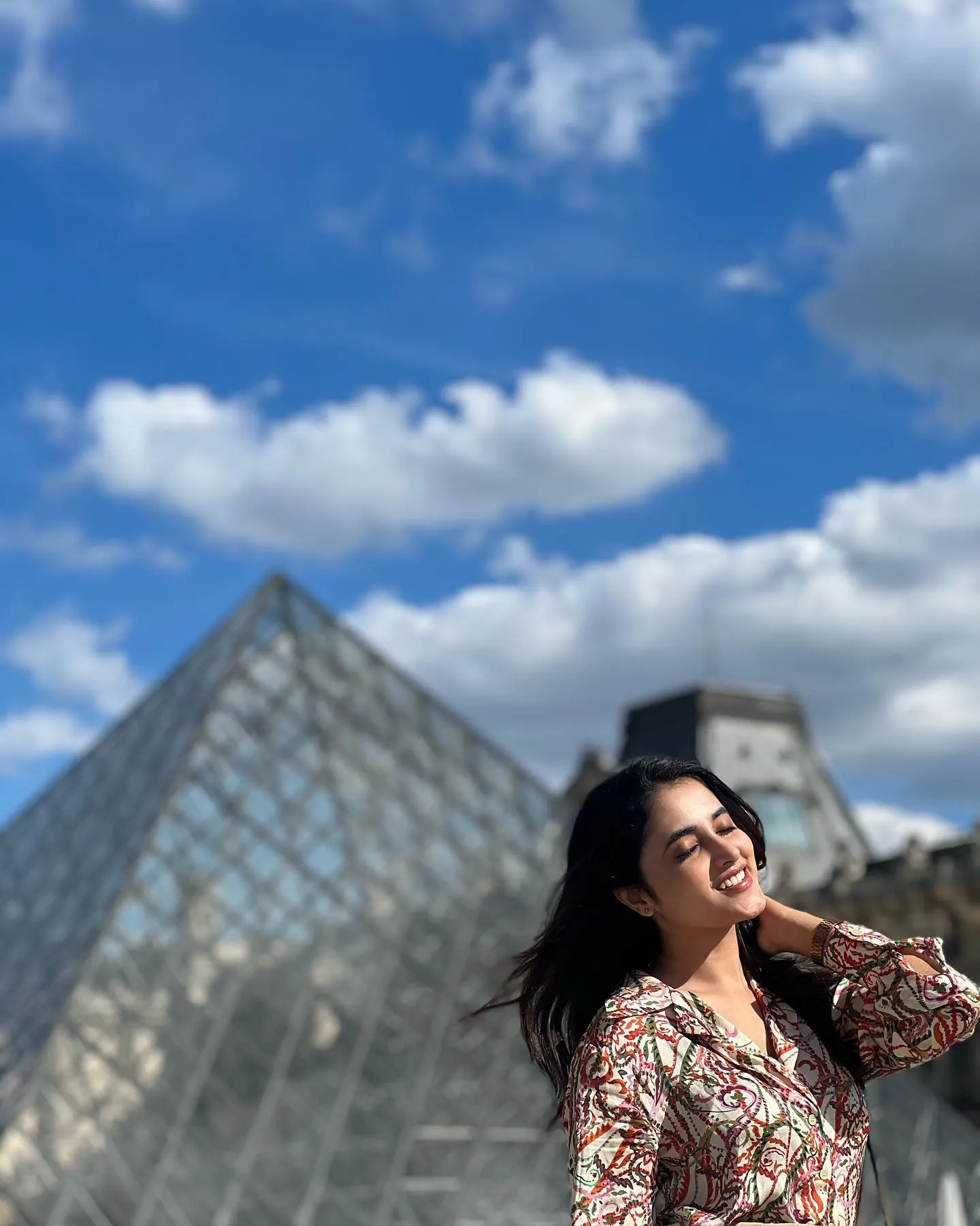 Priyanka Arul Mohan Near Glass Pyramid on a Sunny Day image