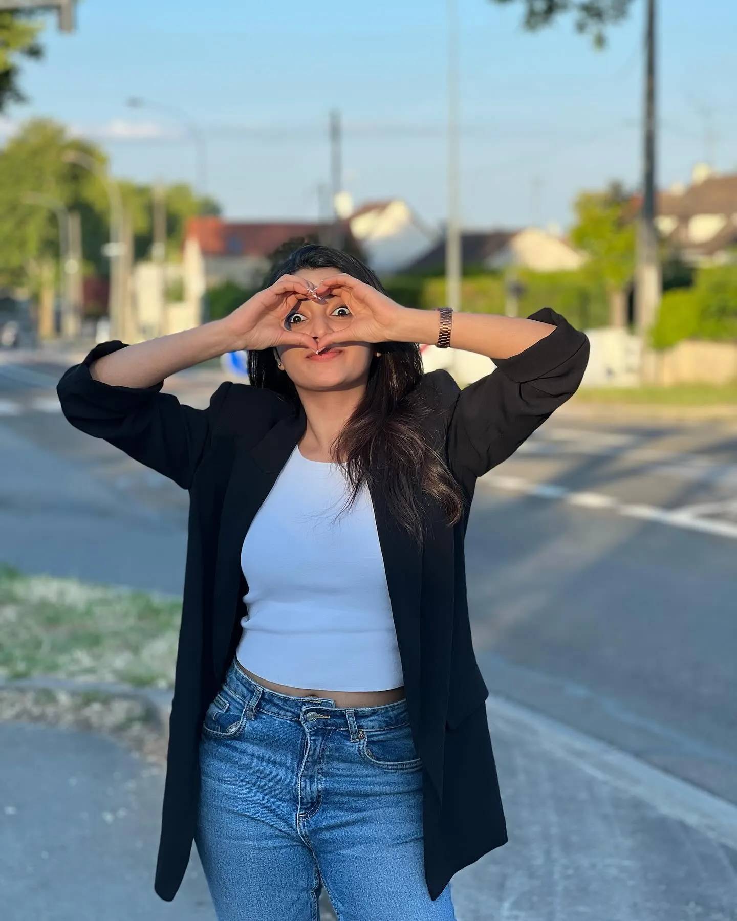 Priyanka Arul Mohan Posing Playfully on Roadside Wallpaper