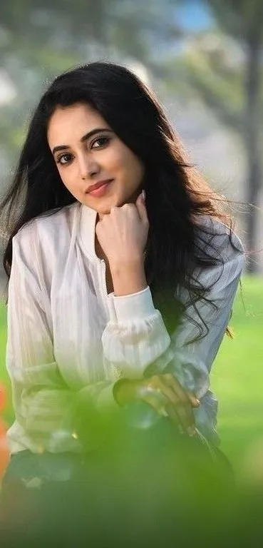 Priyanka Arul Mohan sitting in Peaceful Nature with smile