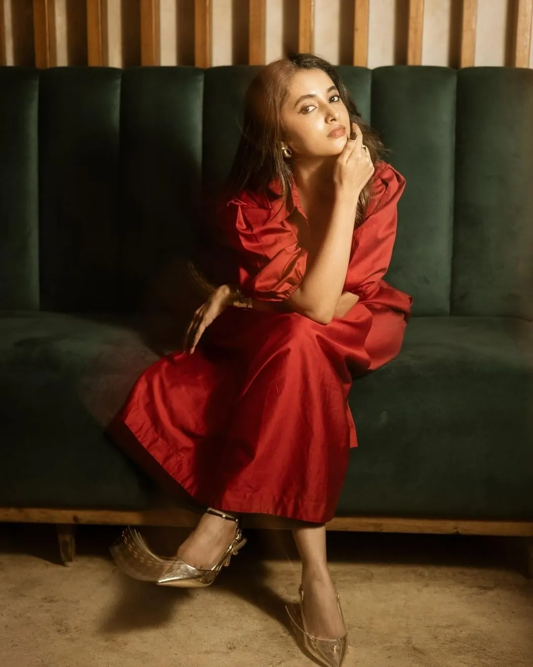 Priyanka Arul Mohan Sitting Thoughtfully in Red Dress image
