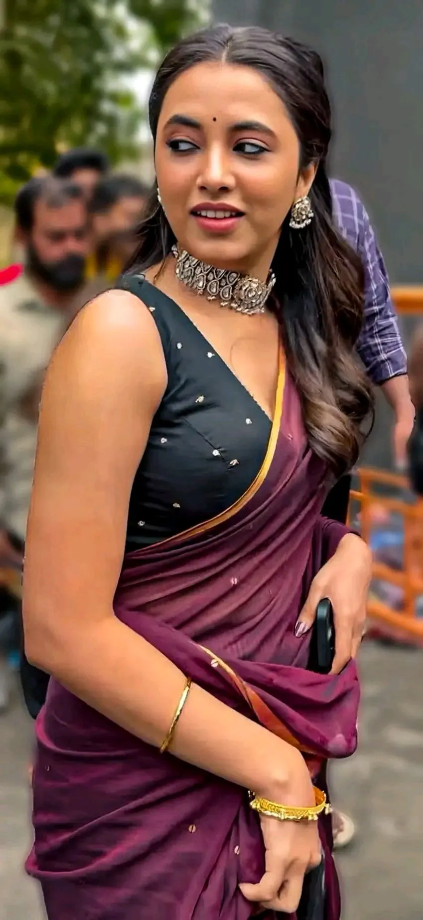 Priyanka Arul Mohan Smiling with a Purple Saree at an Event