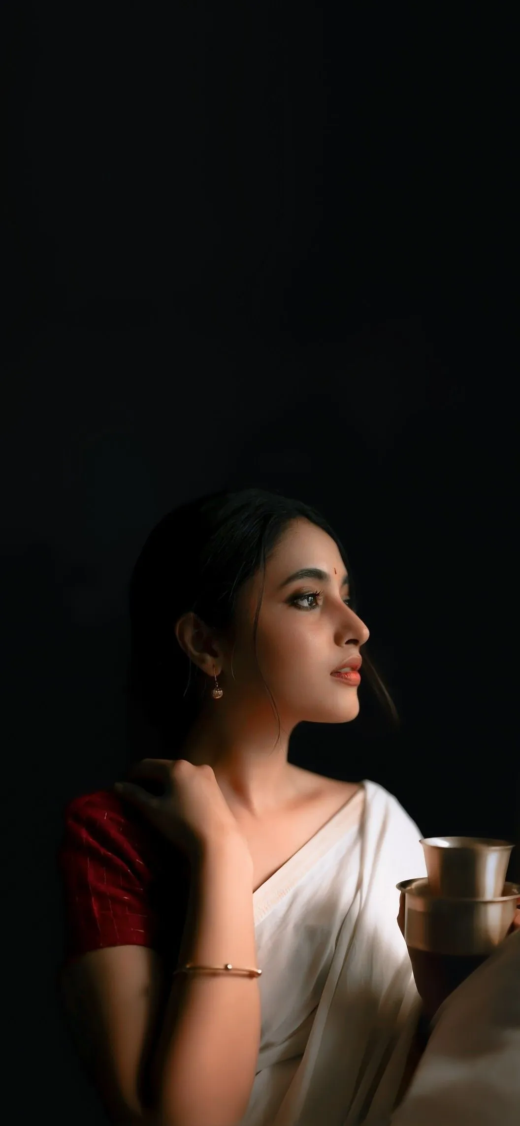 Priyanka Arul Mohan Thoughtful Expression in Dark Backdrop