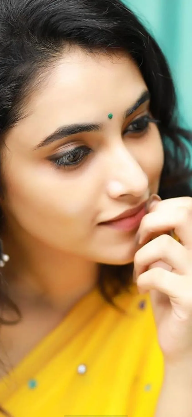 Priyanka Arul Mohan Thoughtful Expression in Yellow Saree