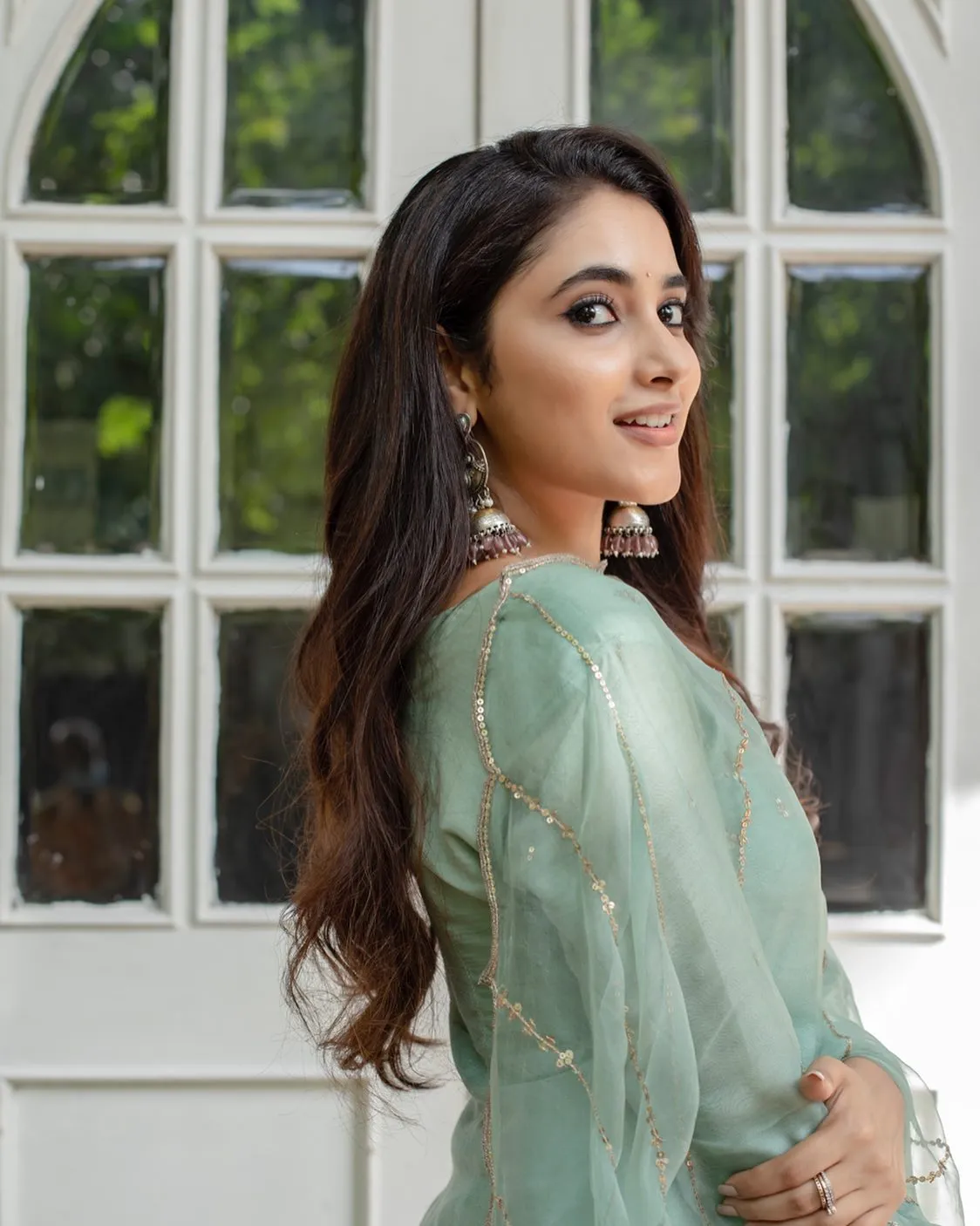 Priyanka Arul Mohan Wearing Gray Outfit Standing by Window