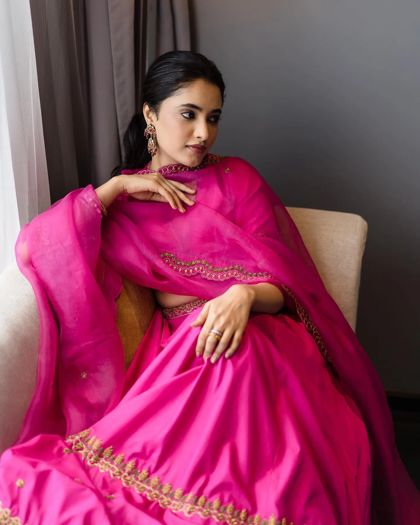Priyanka Arul Mohan Wearing Pink Saree in Relaxed Pose image