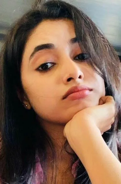 Priyanka casual relaxed pose with chin resting on hand