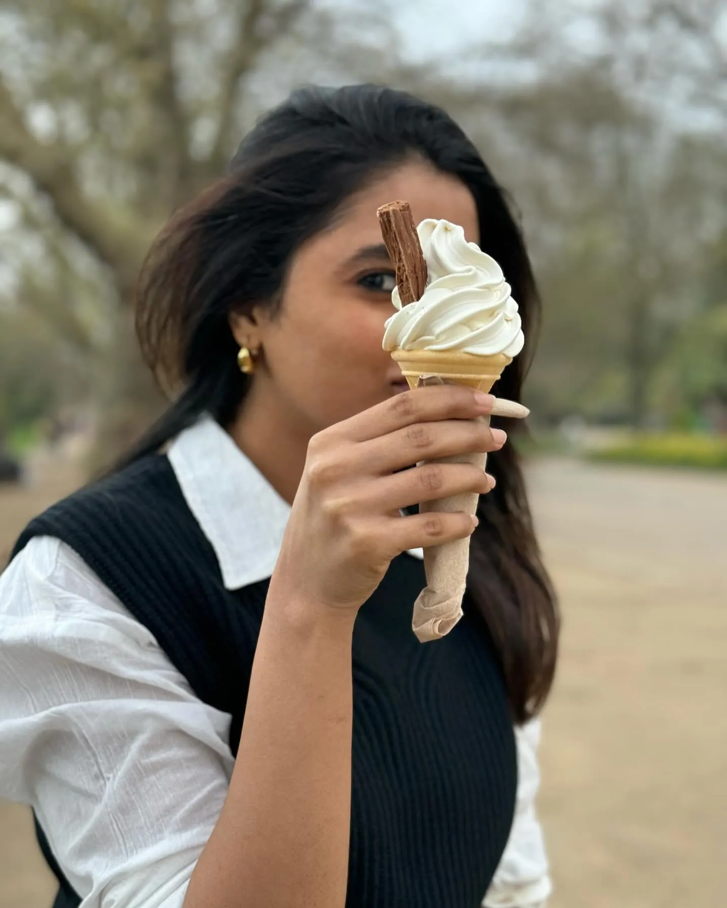 Priyanka enjoying ice cream in casual outside setting image