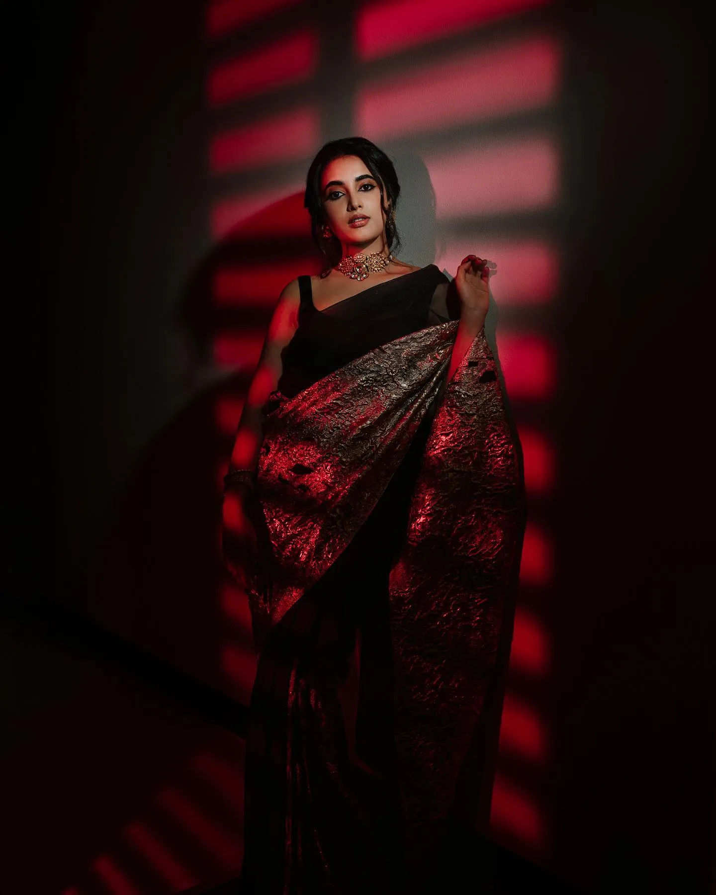 Priyanka in a black saree with red lighting Wallpaper