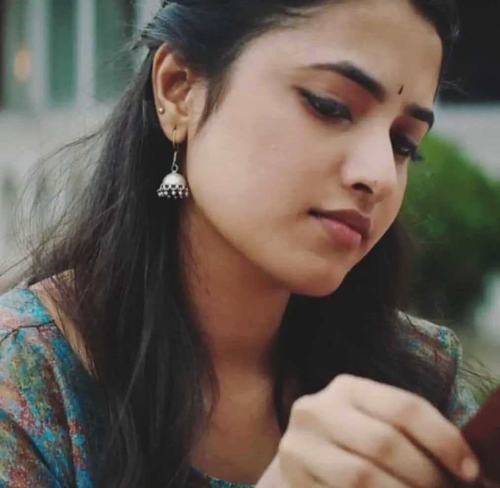 Priyanka in close up looking down with earrings Wallpaper