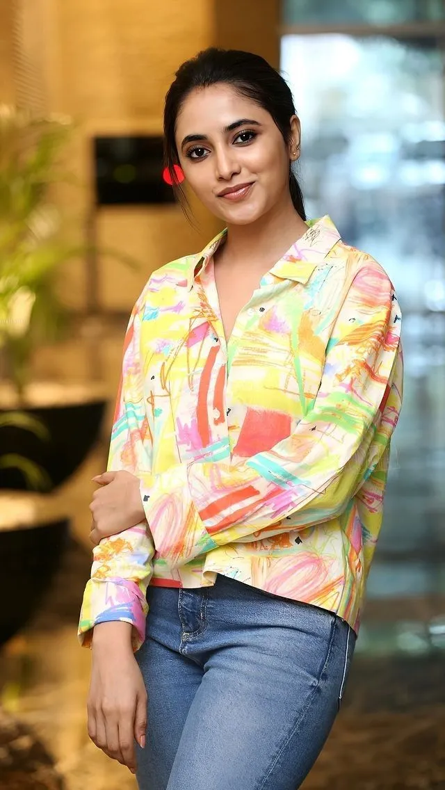Priyanka in colourful shirt with jeans standing casually HD