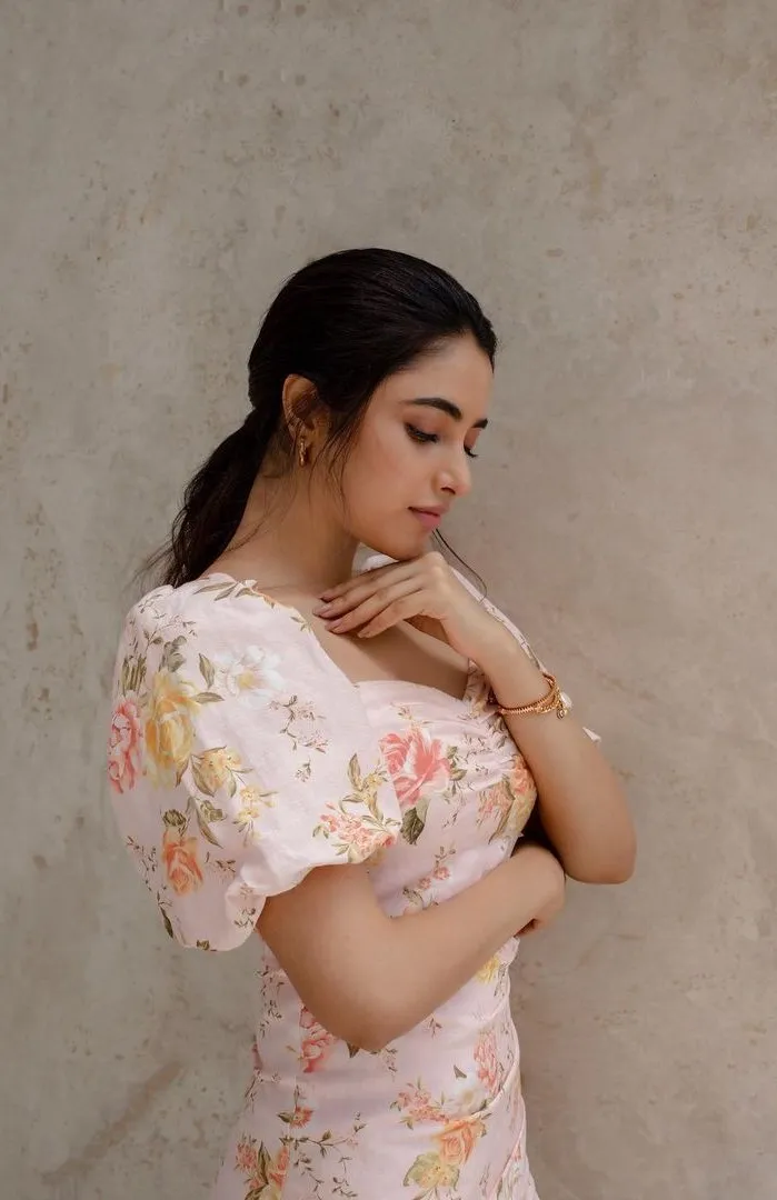 Priyanka in floral dress with serene indoor pose HD image