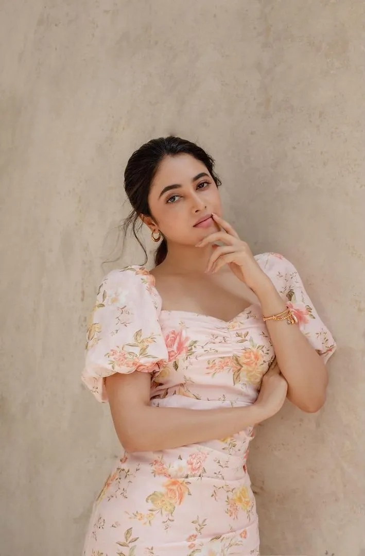 Priyanka in floral outfit with thoughtful expression