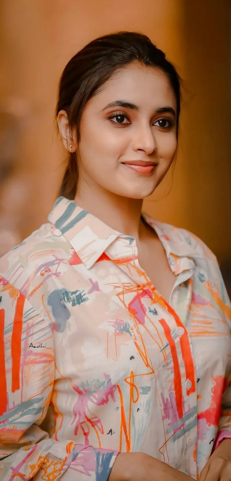Priyanka in floral print top with subtle smile Wallpaper
