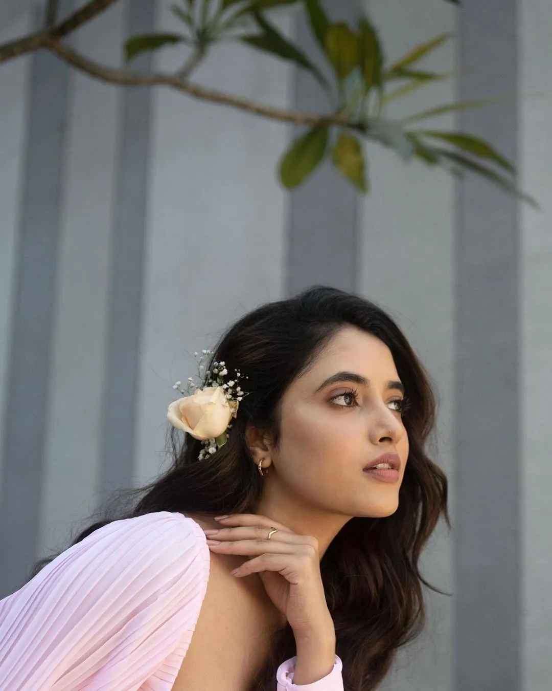 Priyanka in light pink outfit with soft outdoor lighting