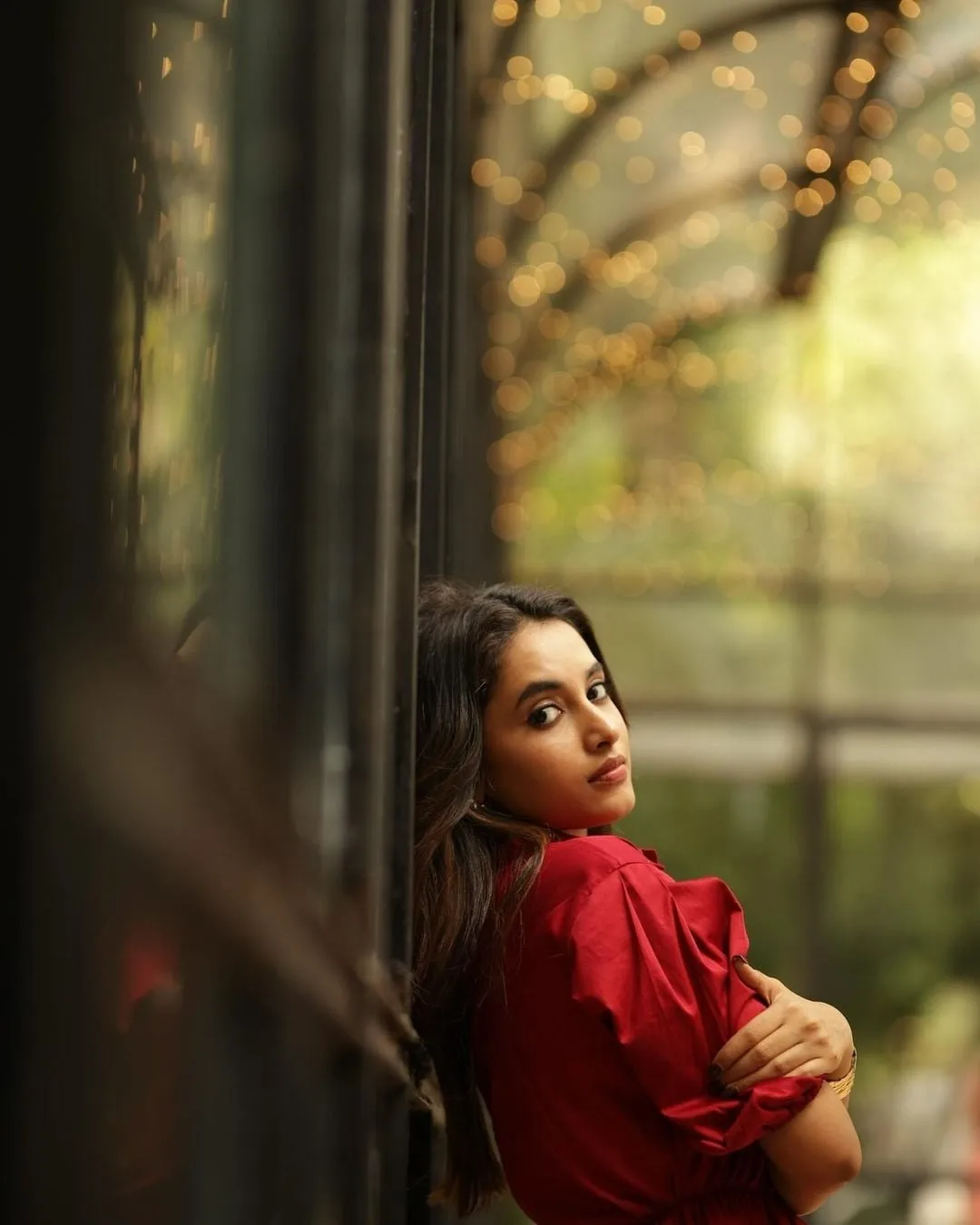 Priyanka in red dress near lights with dreamy vibe image