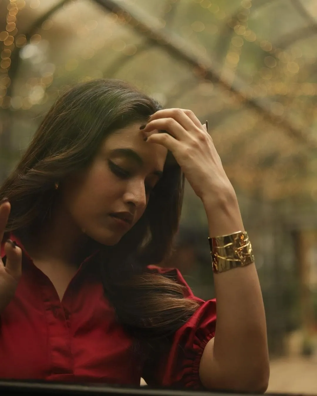 Priyanka in red dress with thoughtful elegant pose Wallpaper
