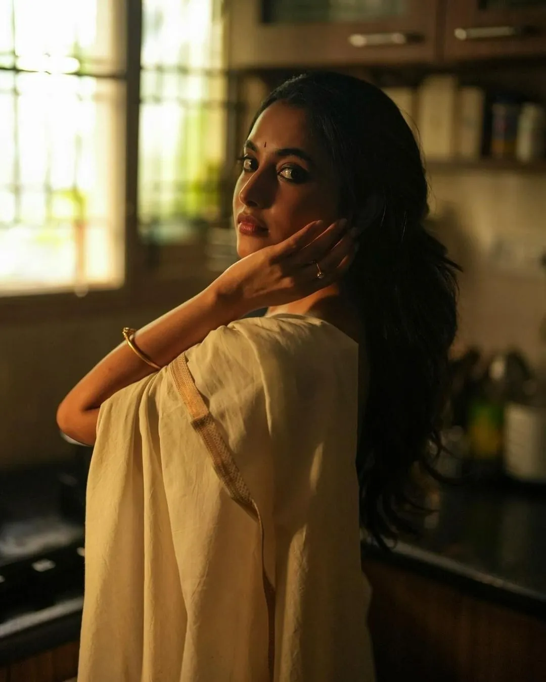 Priyanka in soft yellow saree with serene expression image