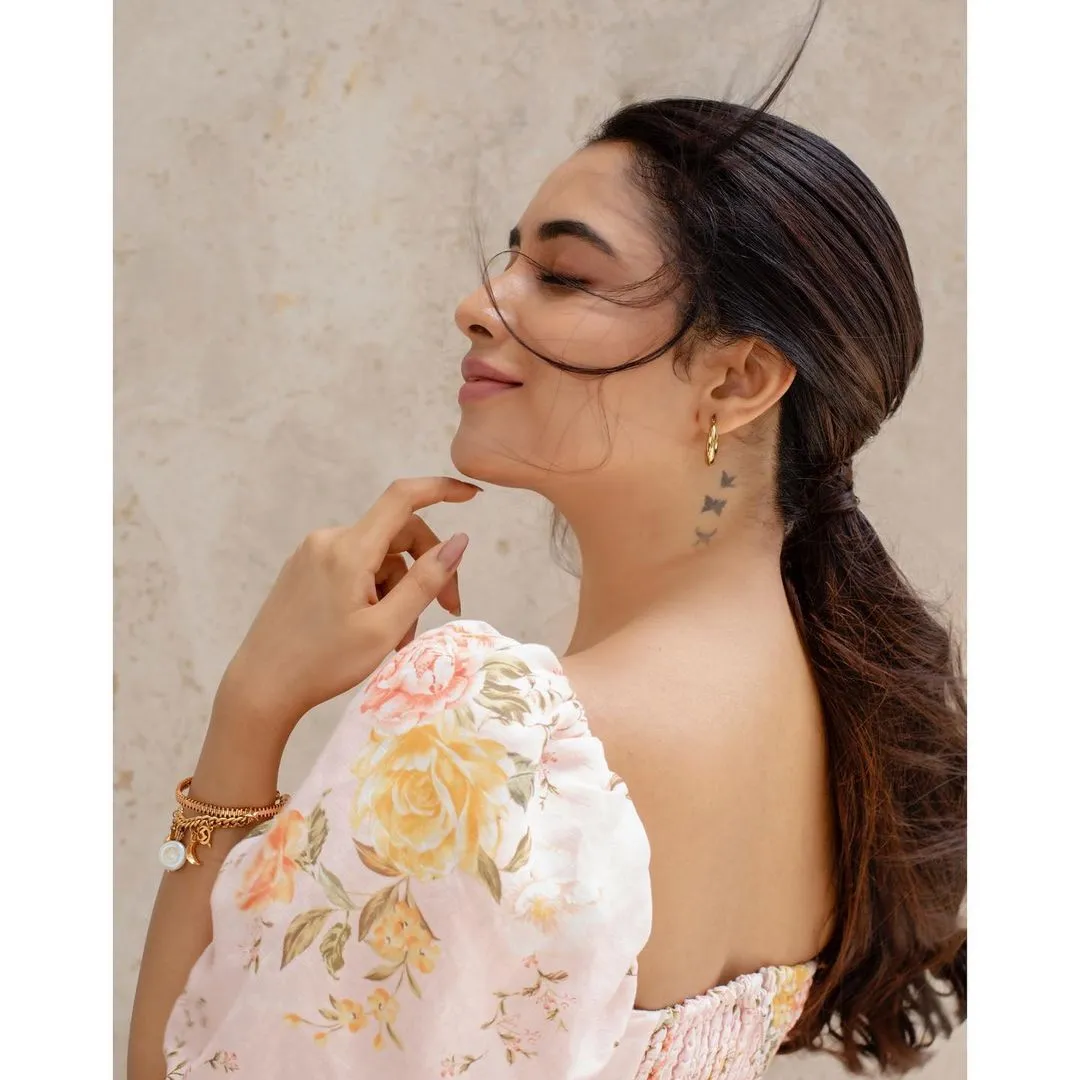 Priyanka in white floral dress turning with smile image