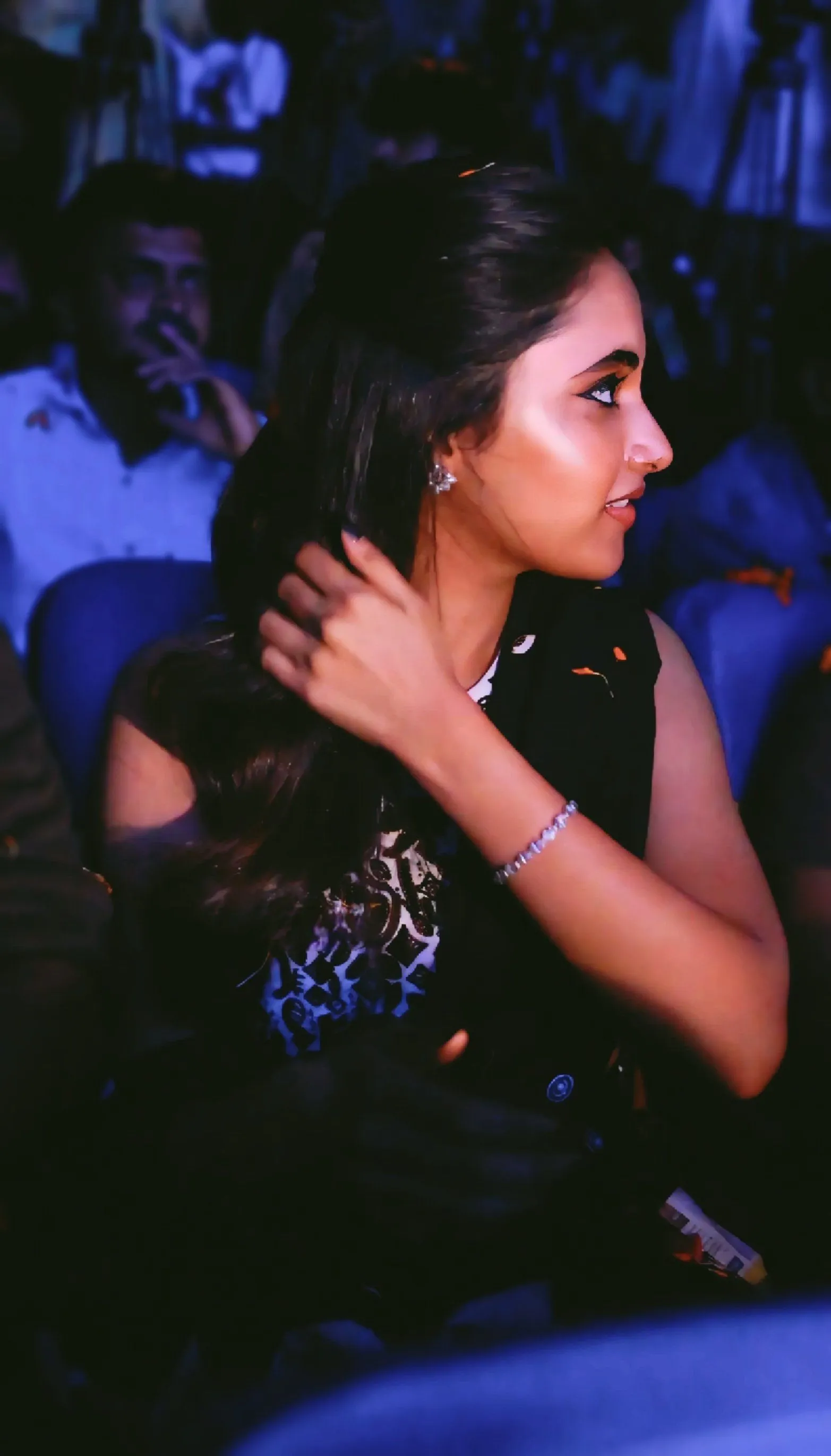 Priyanka Mohan in a Black Dress Sitting at a Function