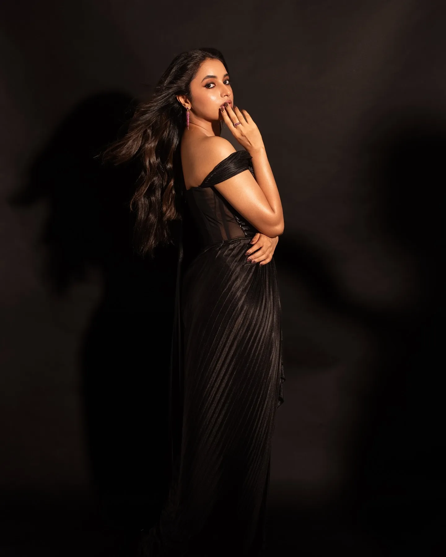 Priyanka Mohan in a Black Dress Standing in the Studio