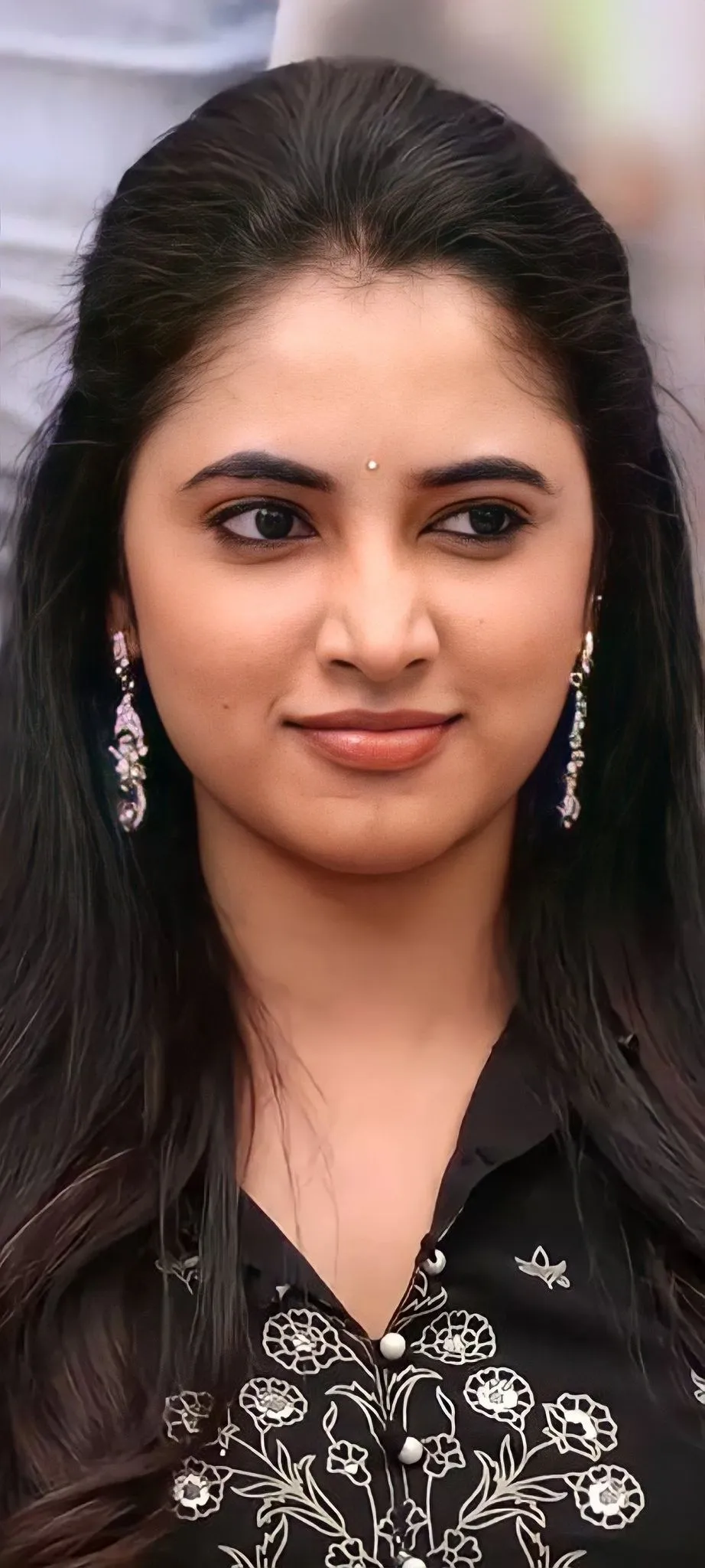 Priyanka Mohan in a Black Dress with a Cute Face Expression