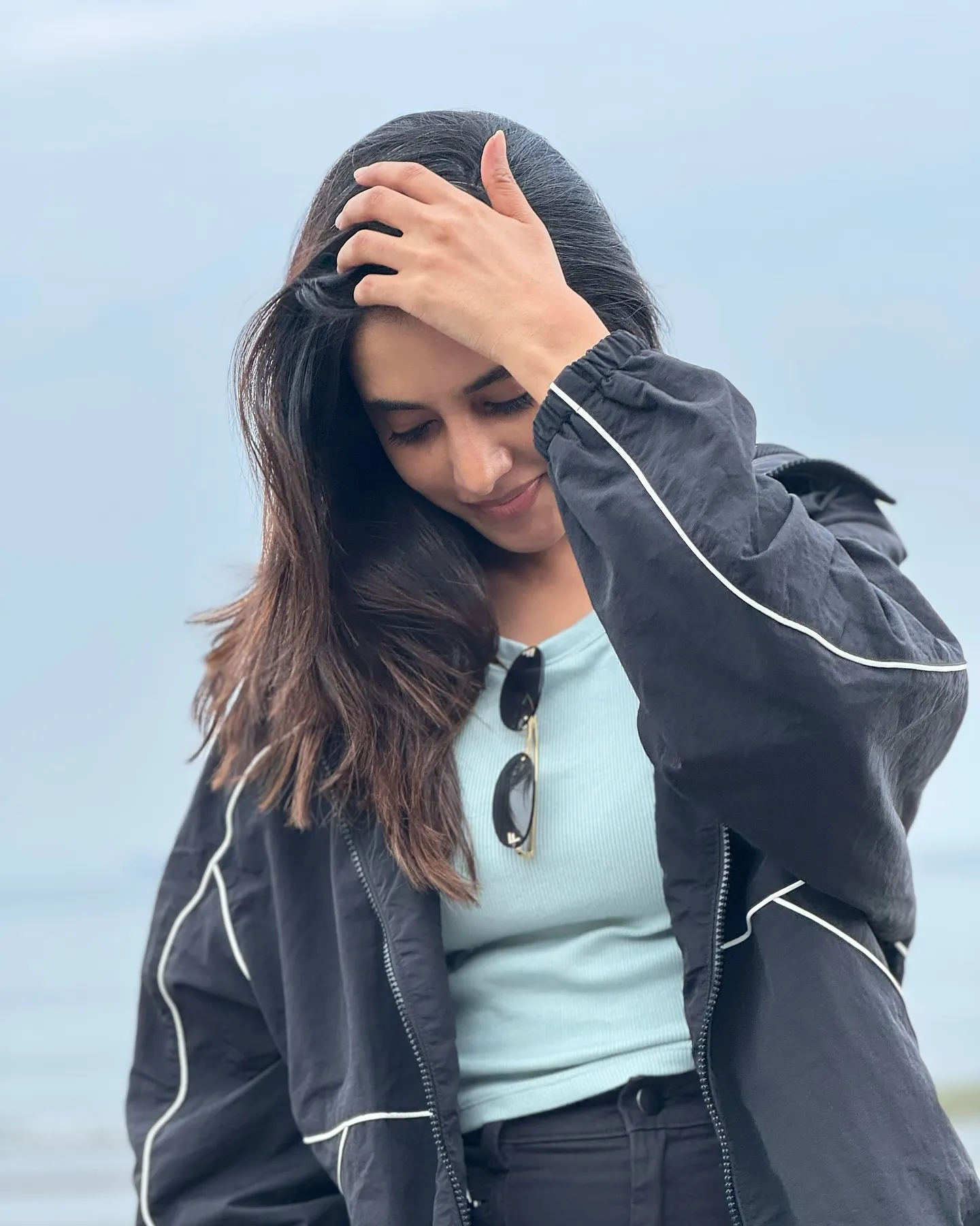 Priyanka Mohan in a Black Dress with Her Hand on Her Head