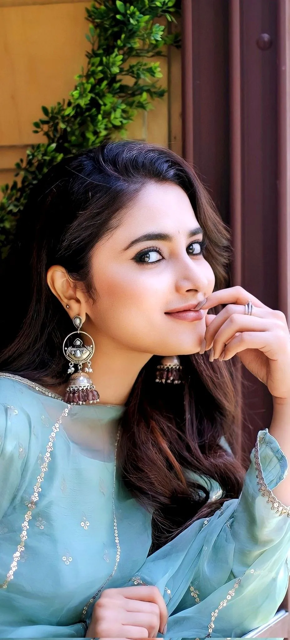 Priyanka Mohan in a Blue Dress with Her Hand on Her Lips