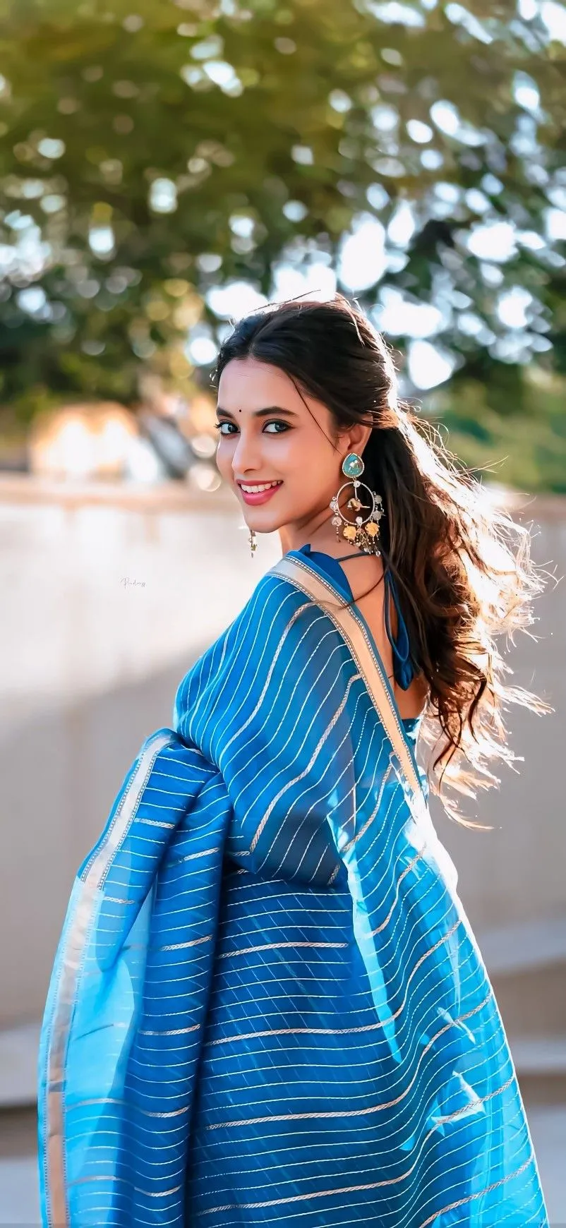 Priyanka Mohan in a Blue Saree Looking Back in the Sunlight