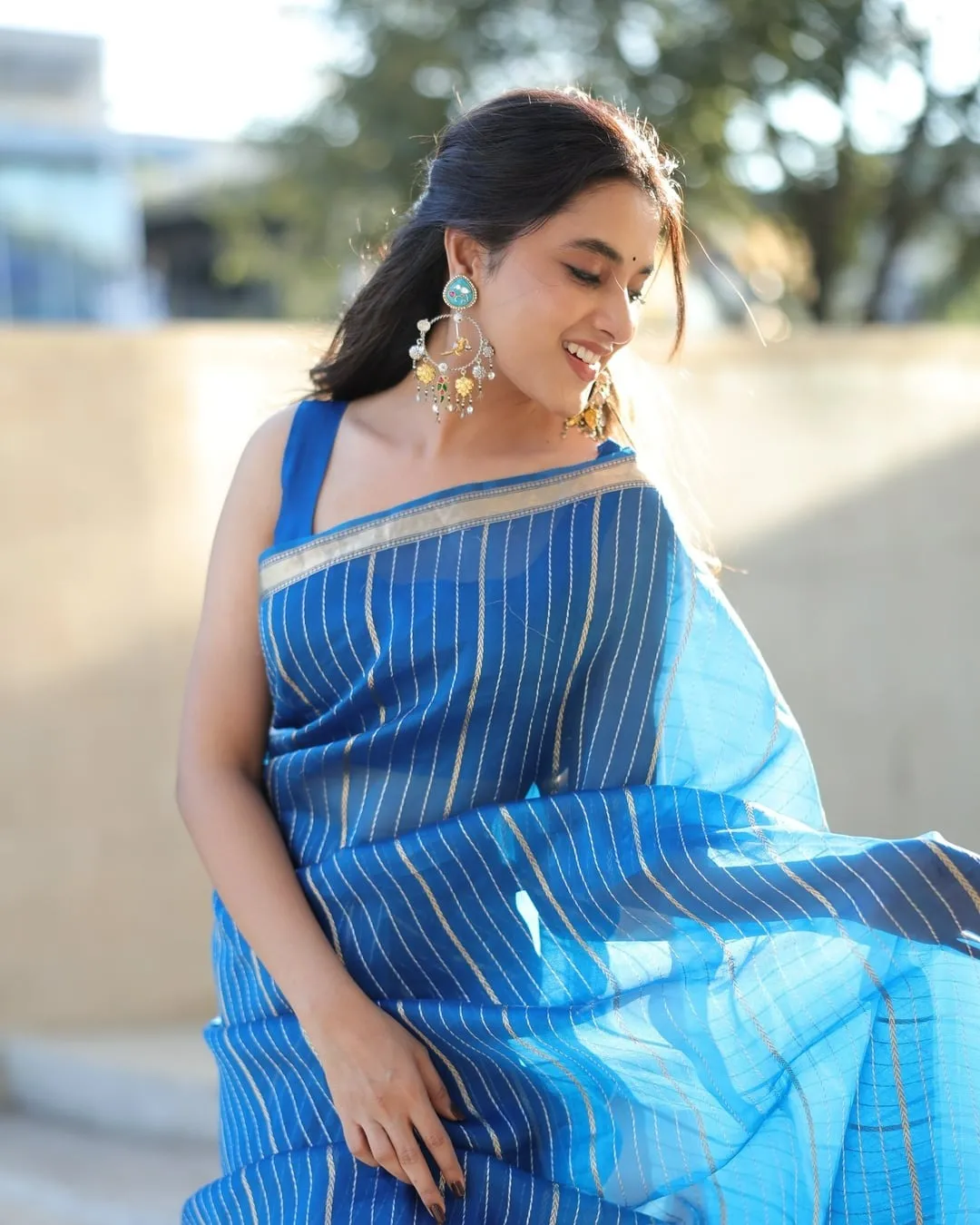 Priyanka Mohan in a Blue Saree with Golden Stripes Wallpaper