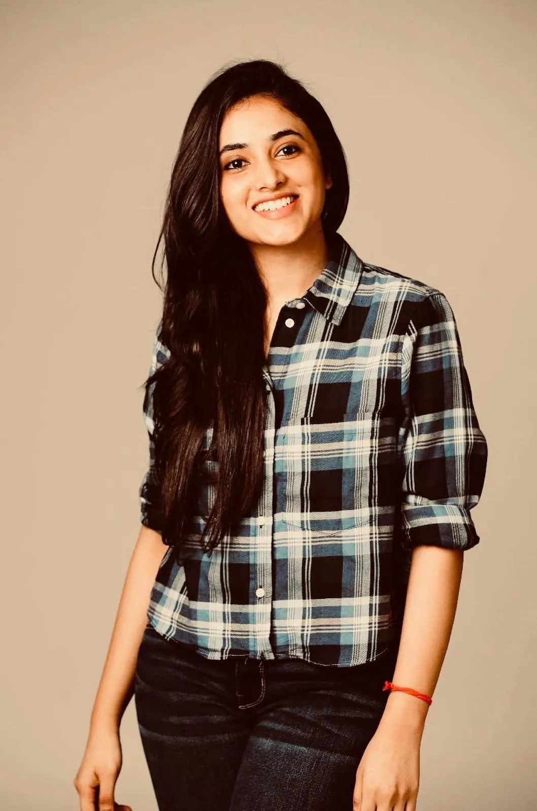 Priyanka Mohan in a Checked Shirt Standing in the Studio