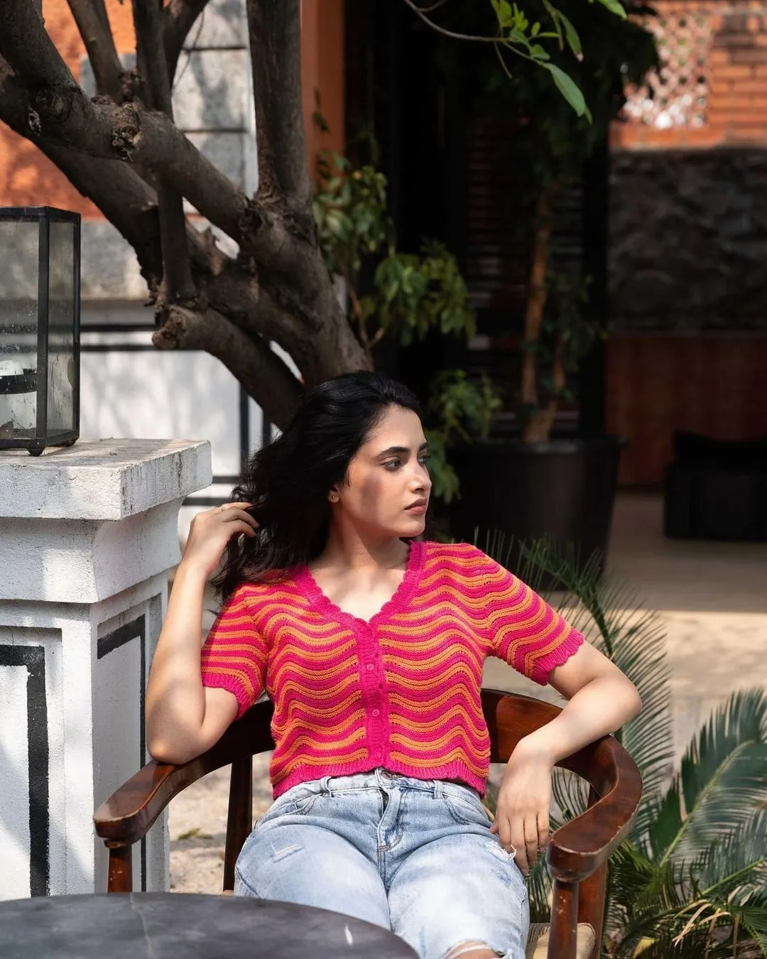 Priyanka Mohan in a Colourful Dress Sitting on the Chair