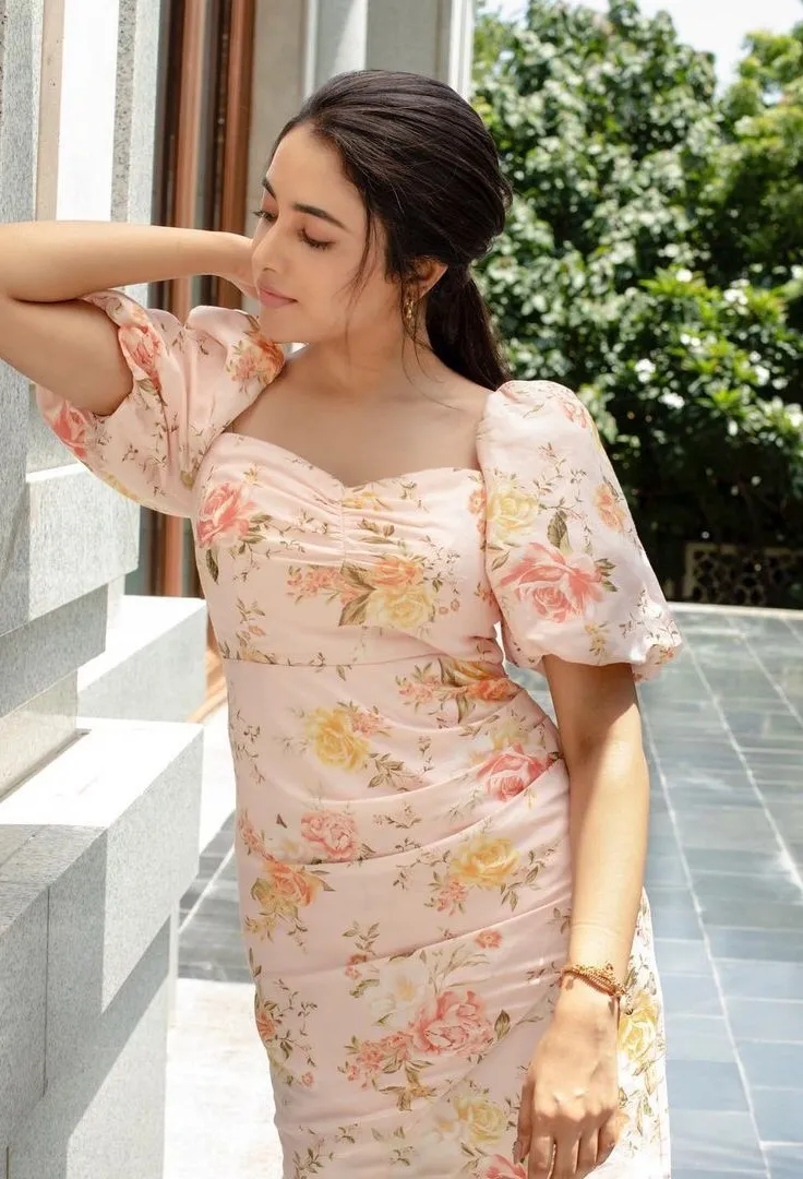 Priyanka Mohan in a Cream Floral Dress Standing Near Window