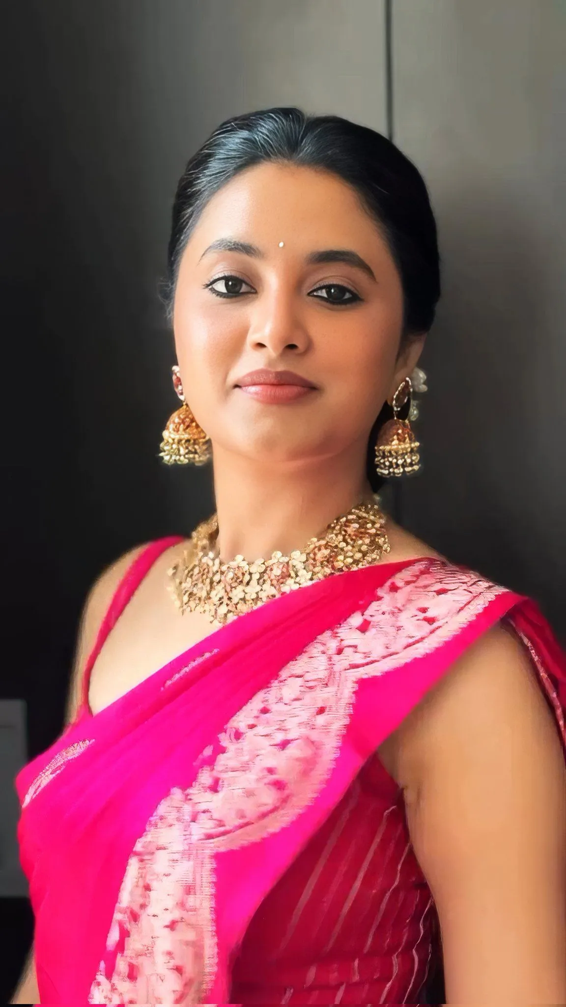 Priyanka Mohan in a Dark Pink Saree Looking at the Camera